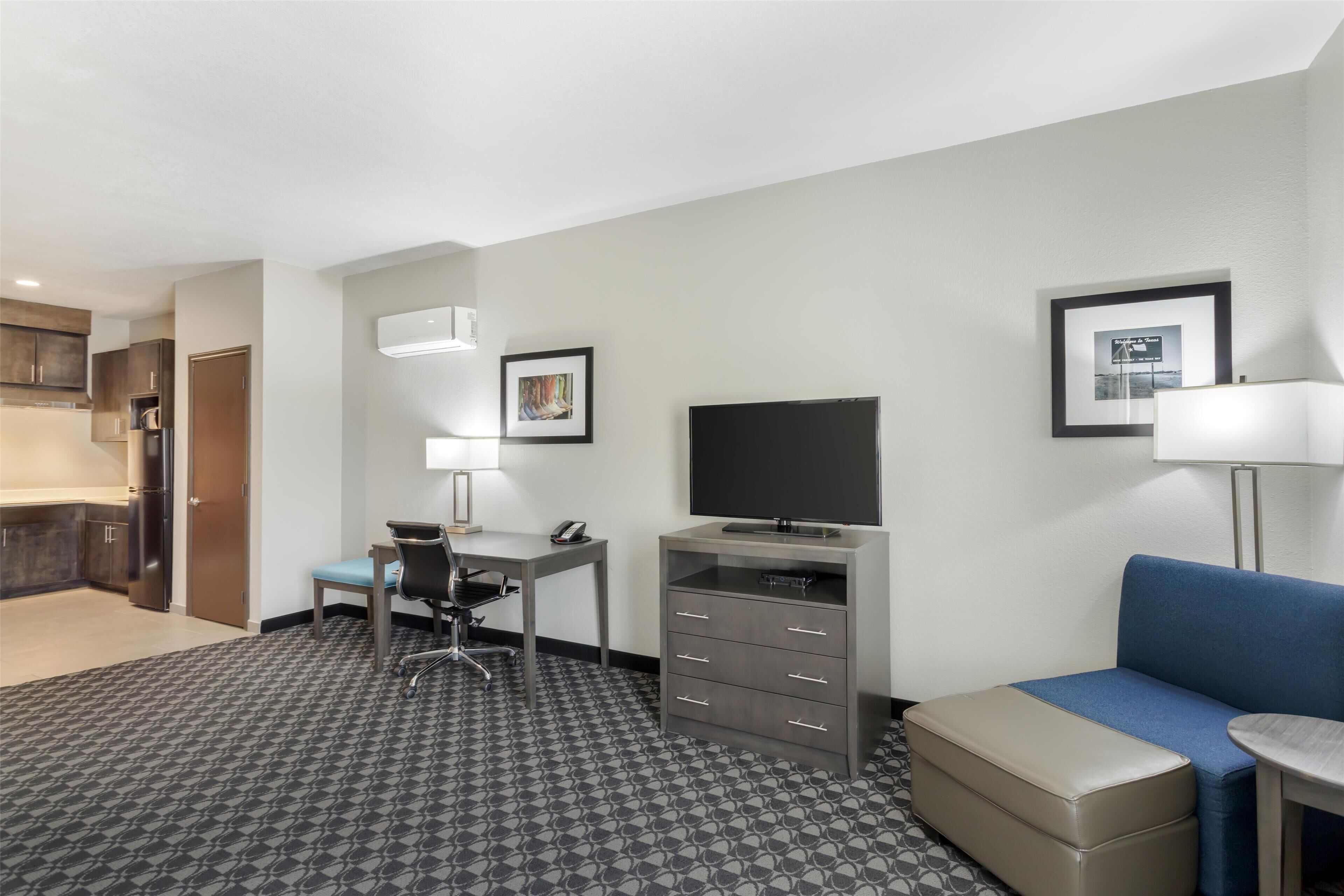 suite, 1 king bed, non smoking, kitchenette (larger room) | pillow-top beds, desk, laptop workspace, iron/ironing board