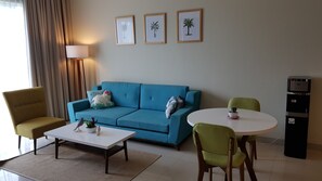 Apartment, 1 Bedroom | Living room | 45-inch LED TV with cable channels, TV - Koen's Home (Denpasar)