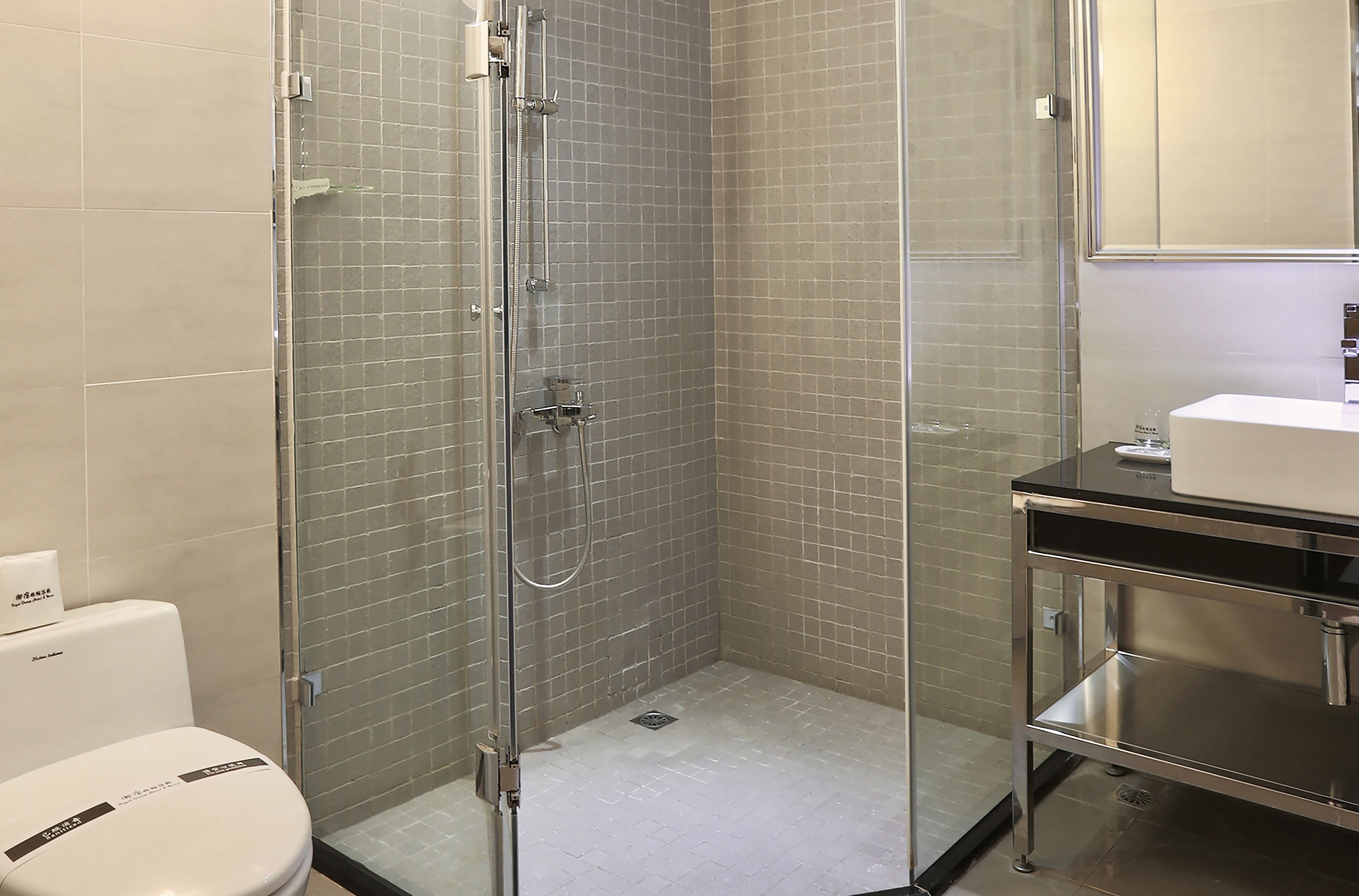 shower, hair dryer, slippers, towels