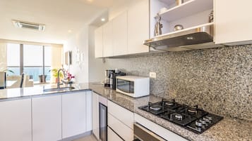 Luxury Condo, Multiple Beds, Non Smoking | Private kitchen | Full-sized fridge, microwave, oven, stovetop