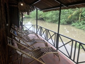 Deluxe Quadruple Room, Private Bathroom, River View | Balcony - HomeTravel Mekong Can Tho - Hostel (Can Tho)