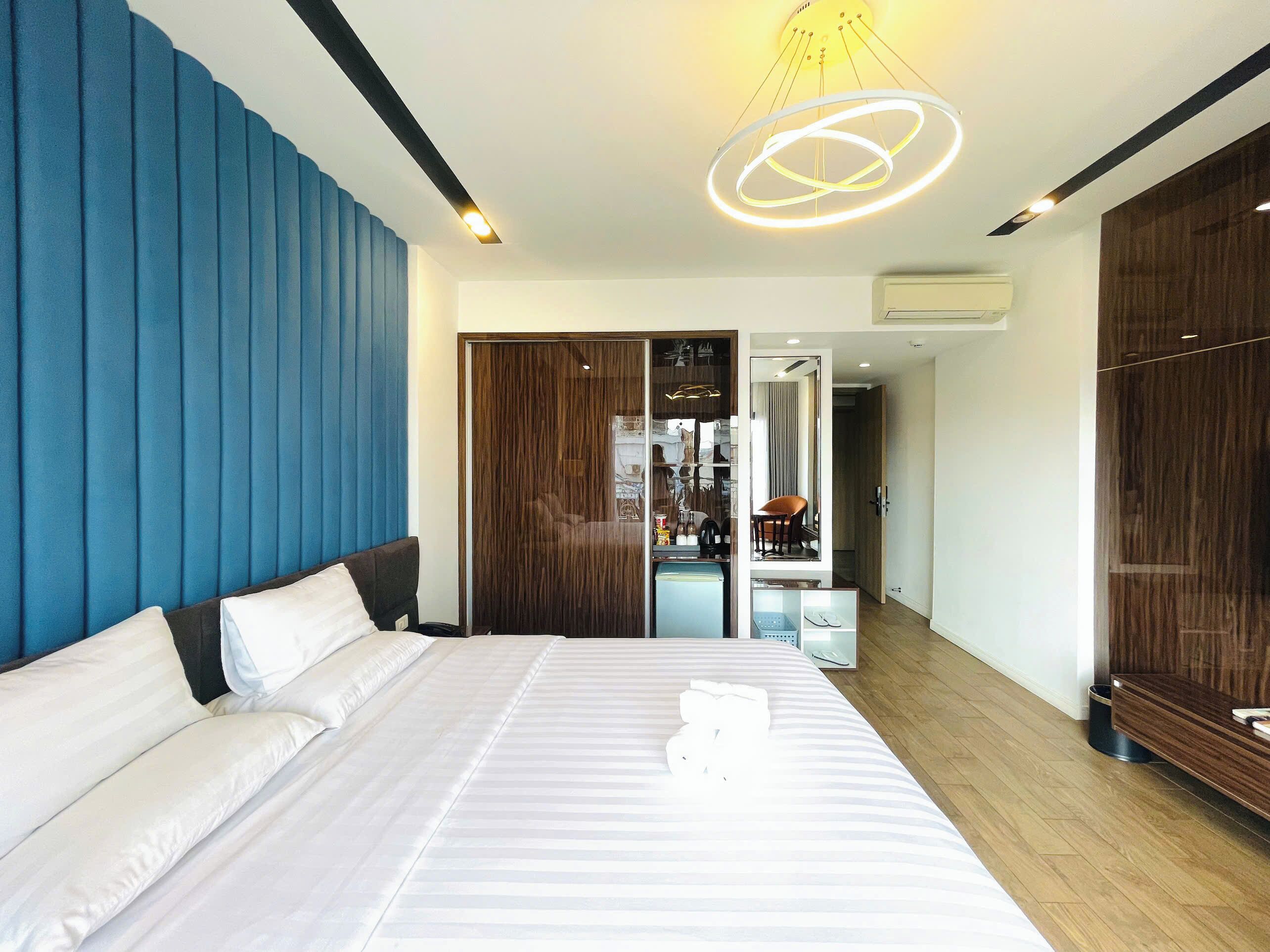 designer toiletries, hair dryer, bathrobes, slippers