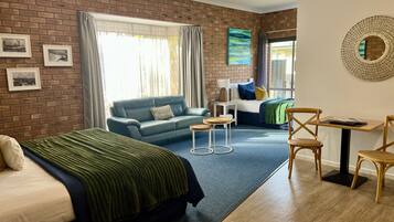 Deluxe Room, 1 King Bed, 1 Single Bed | Minibar, individually decorated, individually furnished, desk