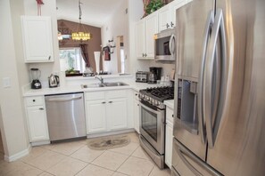 Family Villa, Private Pool, Garden Area | Shared kitchen facilities | Fridge, microwave, oven, high chair