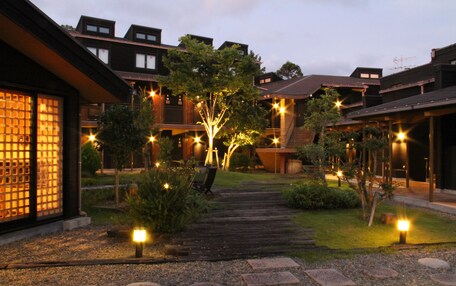 A traditional Japanese-style building with a wooden exterior and a tiled entrance.