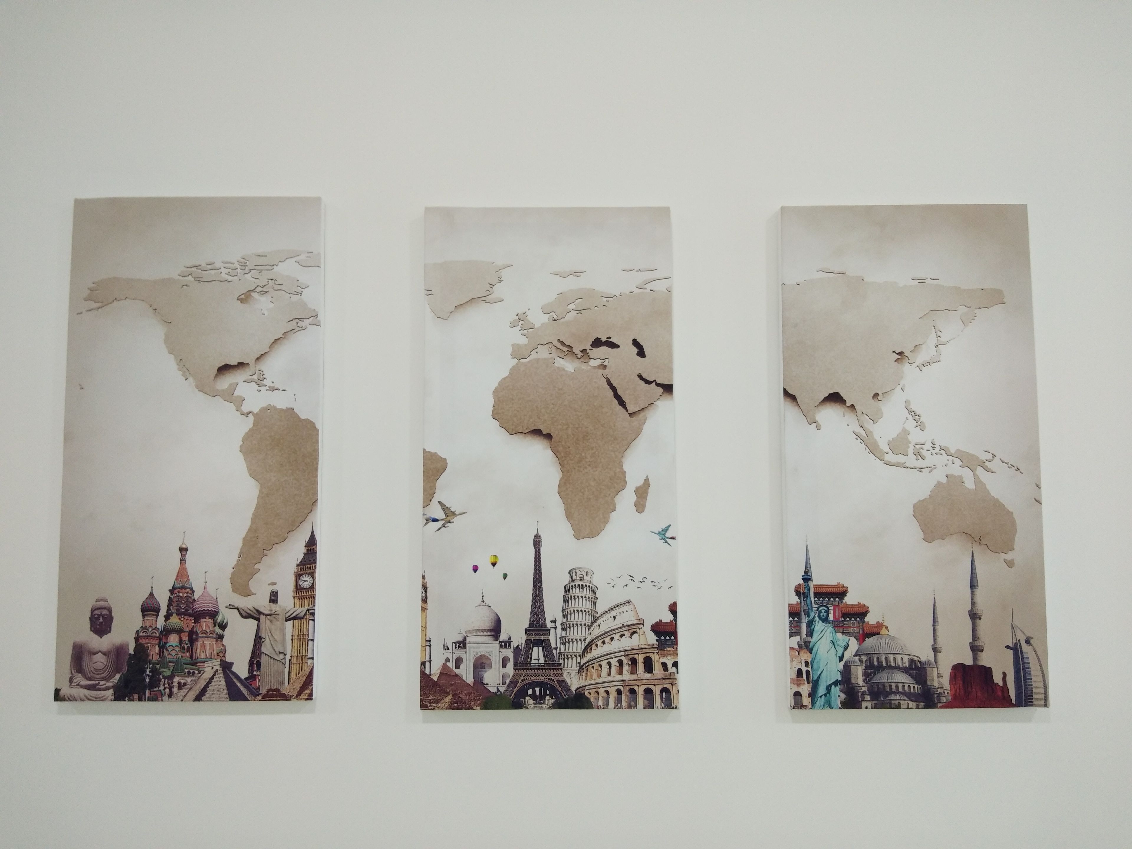 Three vertical panels with a world map and iconic landmarks.