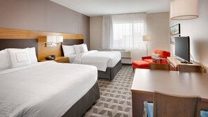 A hotel room with two beds, a desk, a TV, and a window with curtains. - TownePlace Suites by Marriott Salt Lake City Downtown (Salt Lake City)