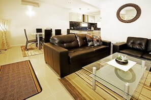 Apartment, 2 Bedrooms | Living area | Flat-screen TV, DVD player