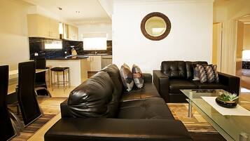 Apartment, 2 Bedrooms | Living area | Flat-screen TV, DVD player