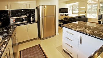 Apartment, 2 Bedrooms | Private kitchen | Full-size fridge, microwave, stovetop, dishwasher