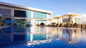 Seasonal outdoor pool, open 10:00 AM to 10:00 PM, free pool cabanas