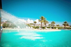 Outdoor pool, open 10:00 AM to 7:00 PM, pool loungers