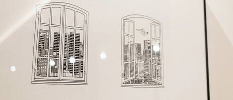 A framed architectural drawing of a building with multiple floors and a central courtyard.