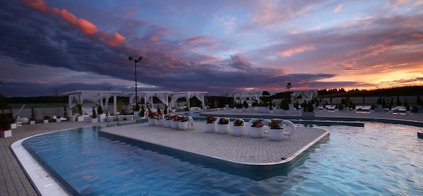 7 indoor pools, outdoor pool, open 10:00 AM to 8 PM, pool loungers