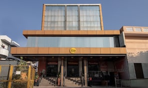 A modern building with a prominent 'etsy' sign, a staircase leading to the entrance, and the name 'Paradise' on the facade. - Itsy Hotels Paradise Inn, Haridwar (Haridwar)