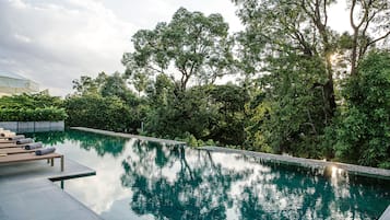 Outdoor pool, open 6 AM to 10 PM, pool umbrellas, sun loungers