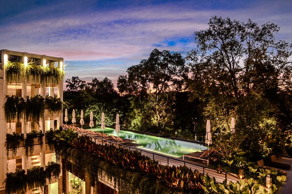 Outdoor pool, open 6 AM to 10 PM, pool umbrellas, pool loungers