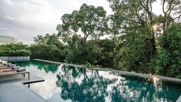 Outdoor pool, open 6 AM to 10 PM, pool umbrellas, pool loungers