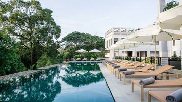 Outdoor pool, open 6 AM to 10 PM, pool umbrellas, sun loungers