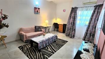 Apartment, 1 Queen Bed, Non Smoking | Living area | 40-inch flat-screen TV with satellite channels, TV