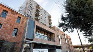 A multi-story building with a sign for 'Greenwich Square Parking'. - Greenwich 602 (Cape Town)