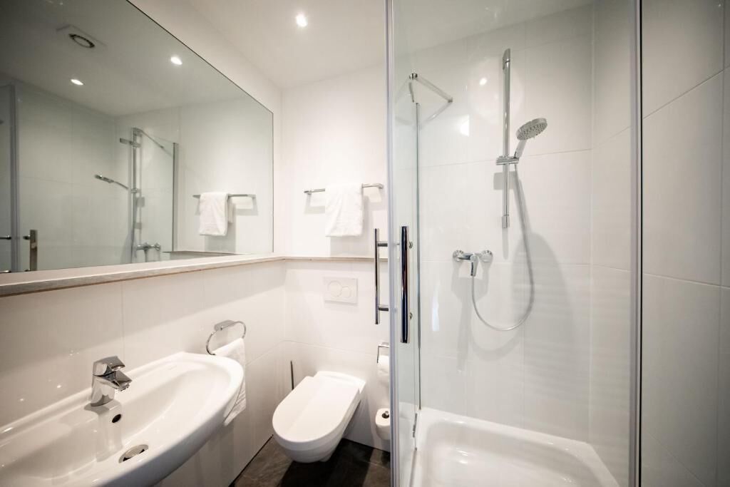 classic double room | bathroom | shower, hair dryer, towels, soap