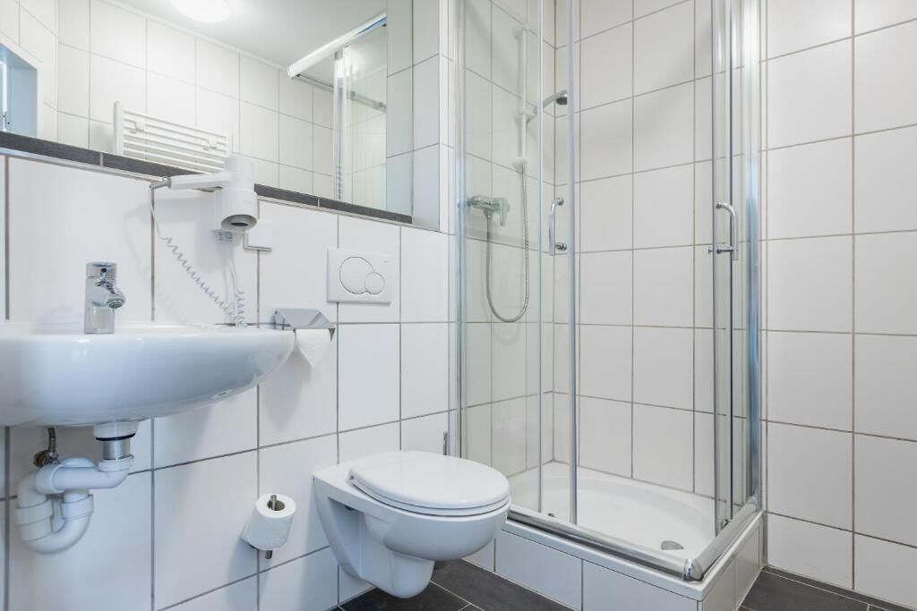 basic double room | bathroom | shower, hair dryer, towels, soap