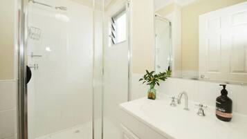 Cattleyard Cottage | Bathroom | Hair dryer, slippers, towels