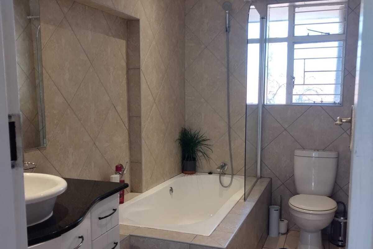 Separate bathtub and shower, deep-soaking bathtub, towels, soap