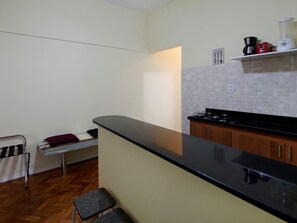 Fridge, microwave, coffee/tea maker, cookware/dishes/utensils