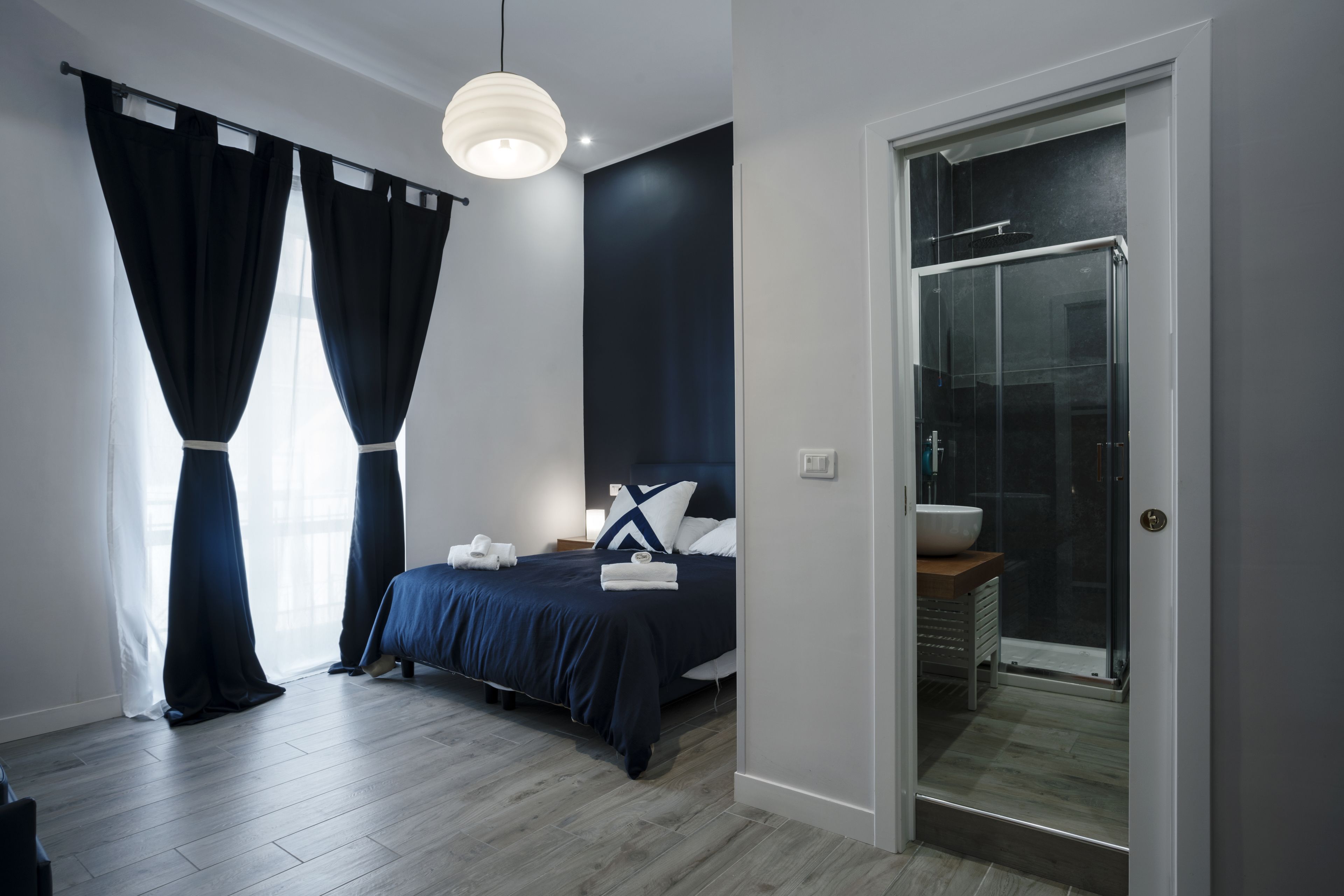 Deluxe Quadruple Room, Balcony | Down duvets, memory-foam beds, individually furnished, desk