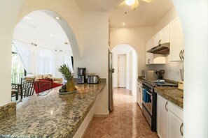 Family Condo, Multiple Beds, Non Smoking | Private kitchen | Full-size fridge, microwave, oven, stovetop