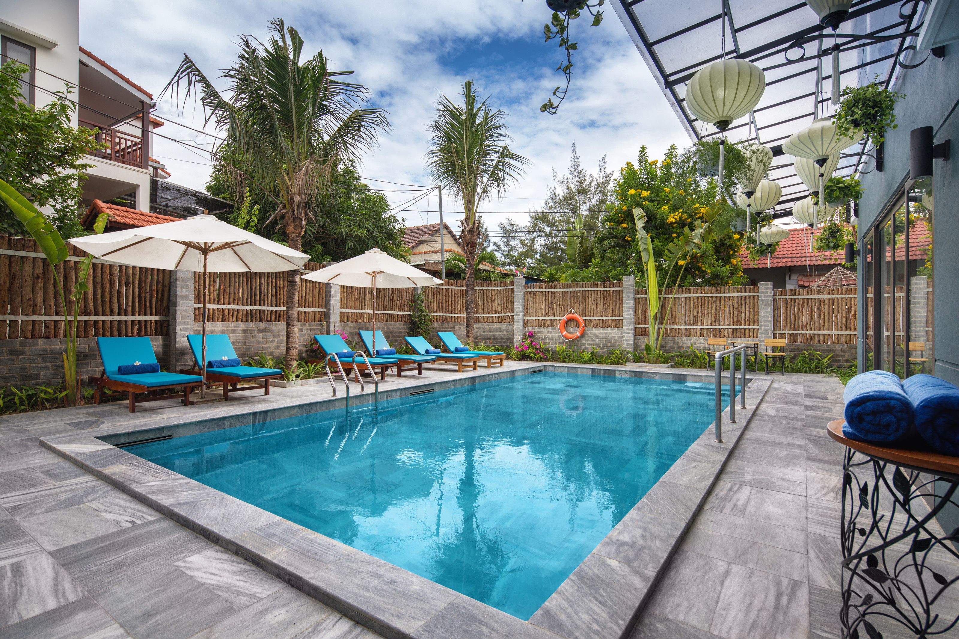 outdoor pool, open 7 am to 8 pm, pool umbrellas, pool loungers