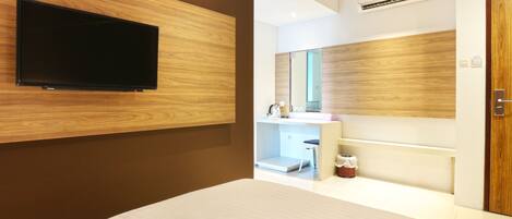 Habitación Deluxe | Ropa de cama de alta calidad y caja de seguridad en la habitación