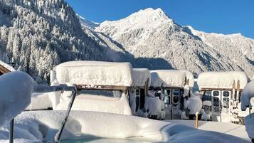 A snow-covered mountain with a clear sky.