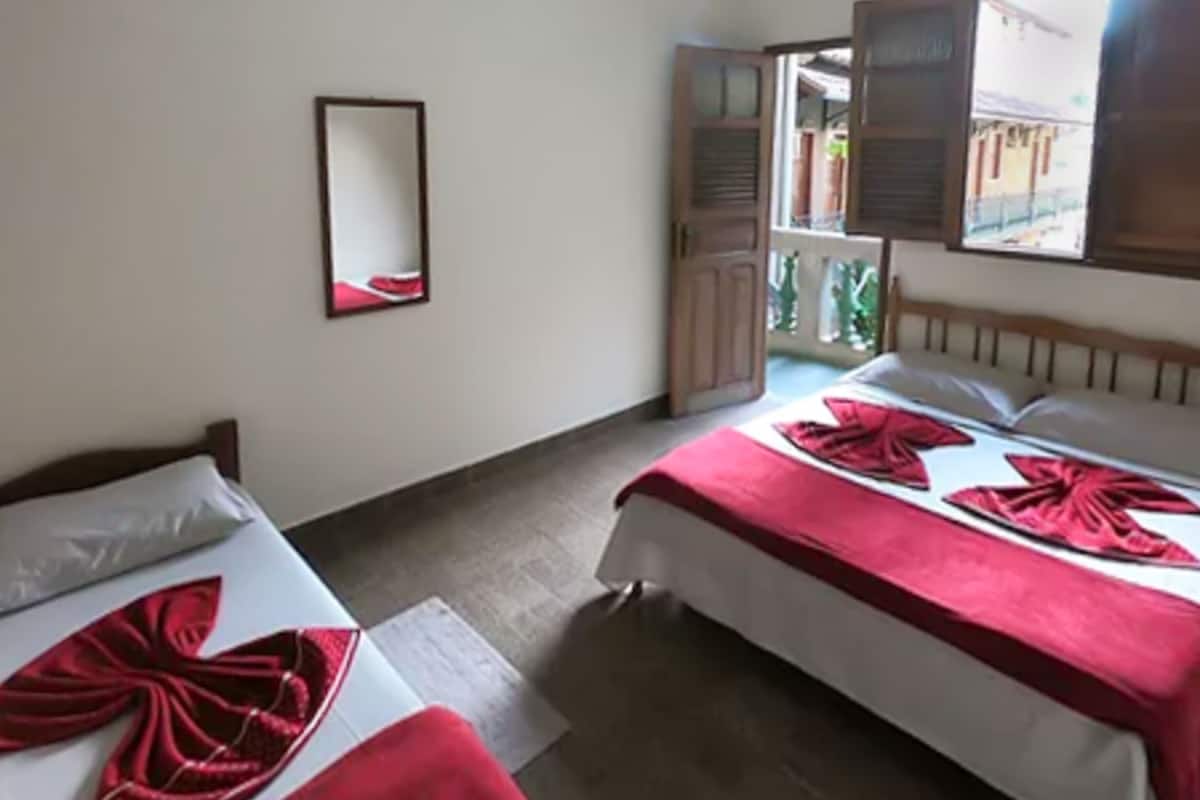 Habitación triple | Minibar, wifi gratis, ropa de cama