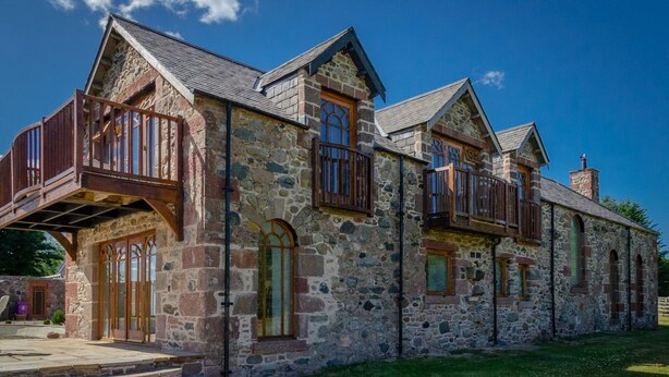A stone building with multiple balconies and large windows. - Castleview - Newton Steading (Kirriemuir)