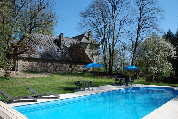 Seasonal outdoor pool, open 10:00 AM to 7:00 PM, pool umbrellas