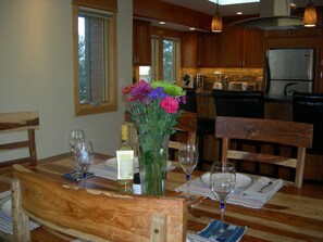 View from dining table looking toward the bar and kitchen with high end finishes