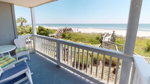 A balcony with a view of the beach, white wicker furniture, and a wooden deck area. - *Fall into Savings-20% Off New Bookings thru 2026* (Surfside Beach)