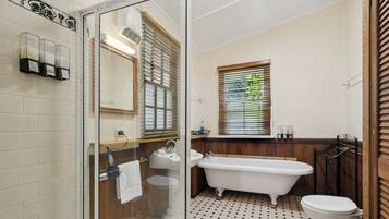Bathtub, hair dryer, towels, shampoo