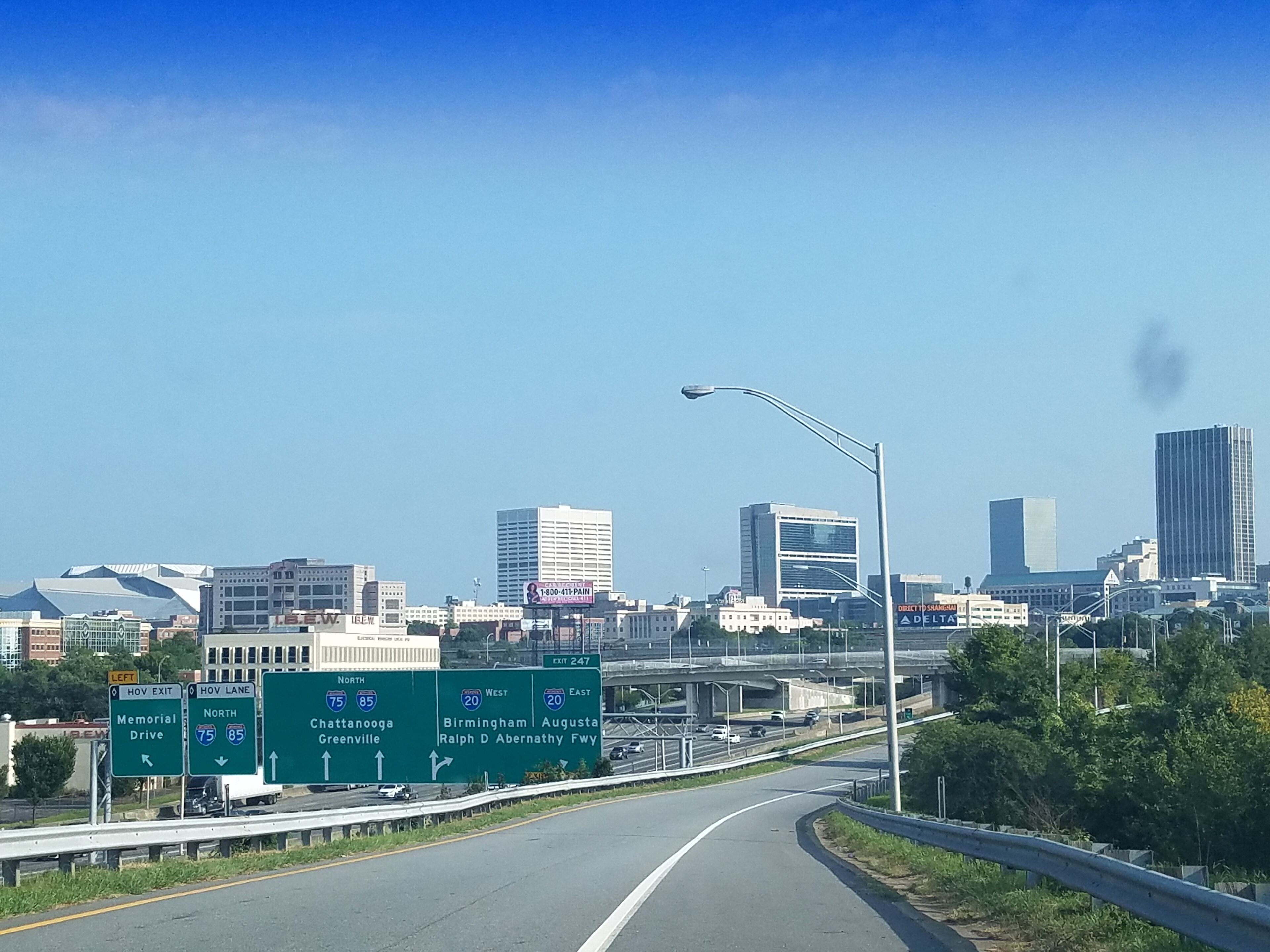 A highway with directional signs for I-75 North, I-85 North, and I-20 West.