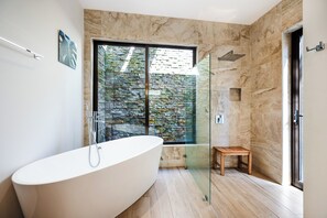 Bathtub, hair dryer, towels, soap