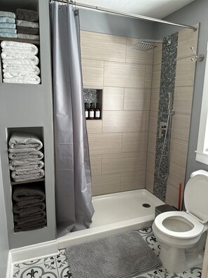 Shower, hair dryer, towels, soap