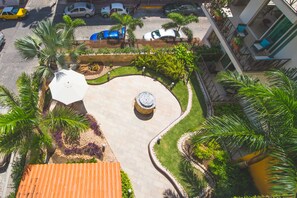 Stroll through our serene courtyard, surrounded by lush plants and palm trees, and enjoy the tranquil atmosphere.