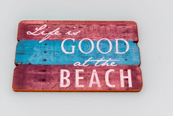 A wooden sign with the text "Life is GOOD at the BEACH". - Spacious Oceanfront Villa, private beach and water access, accommodates 12 (Hato)