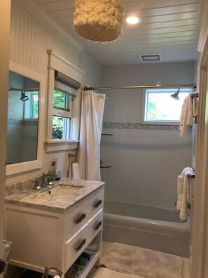 Bathtub, hair dryer, towels