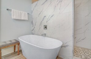 Combined shower/tub, hair dryer, towels, soap
