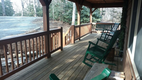 Relax on the deck with a serene view of the surrounding landscape and natural surroundings.