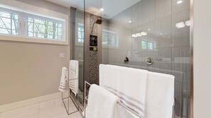 Combined shower/bathtub, hair dryer, towels, soap
